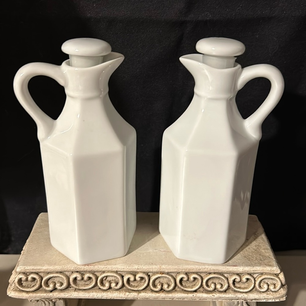 2 White Xcell cruets. 6”H